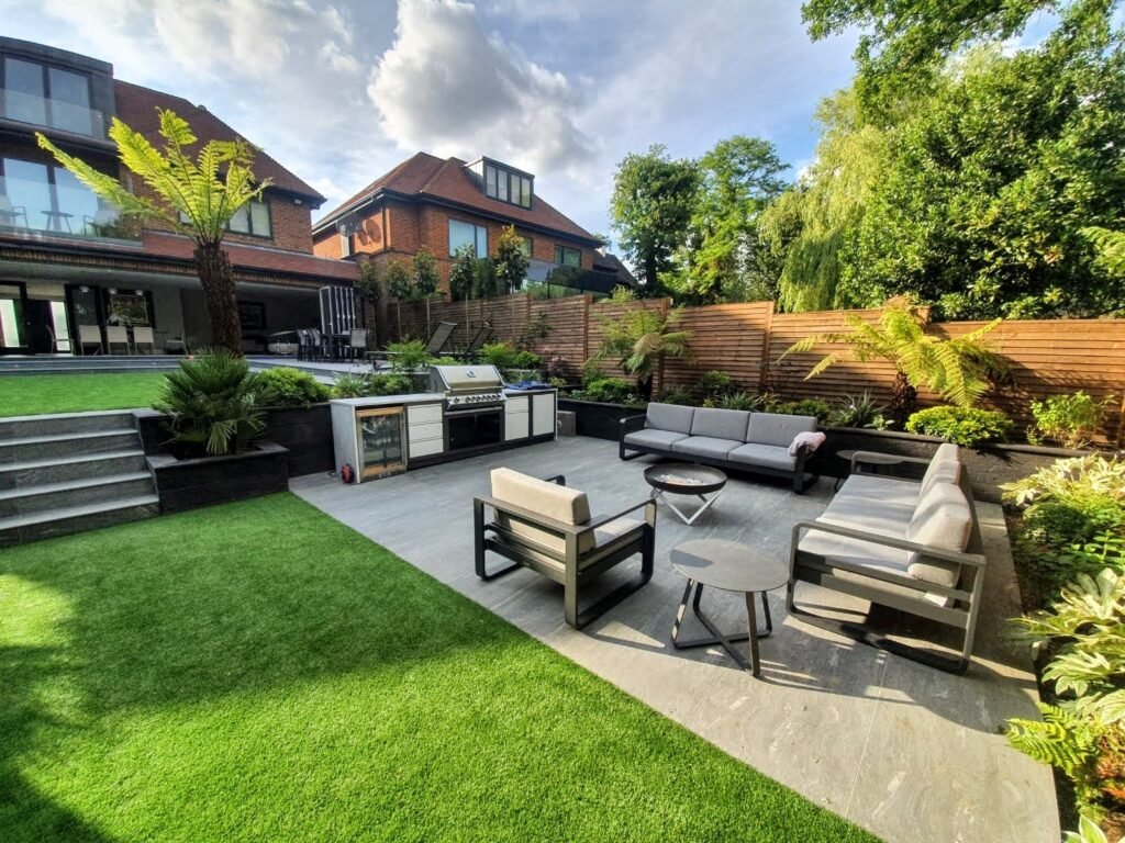 Large garden design project in Mill Hill london with porcelain patio, artificial grass, fencing, outdoor kitchen