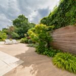 Morden garden design with patio flower beds and fencing